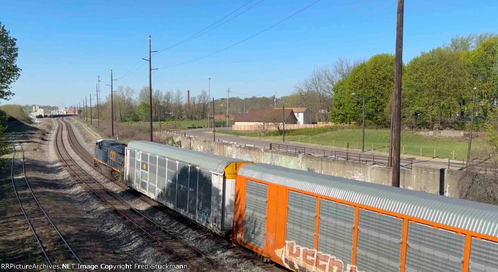 CSX 7276 leads M277 under S. Main St.